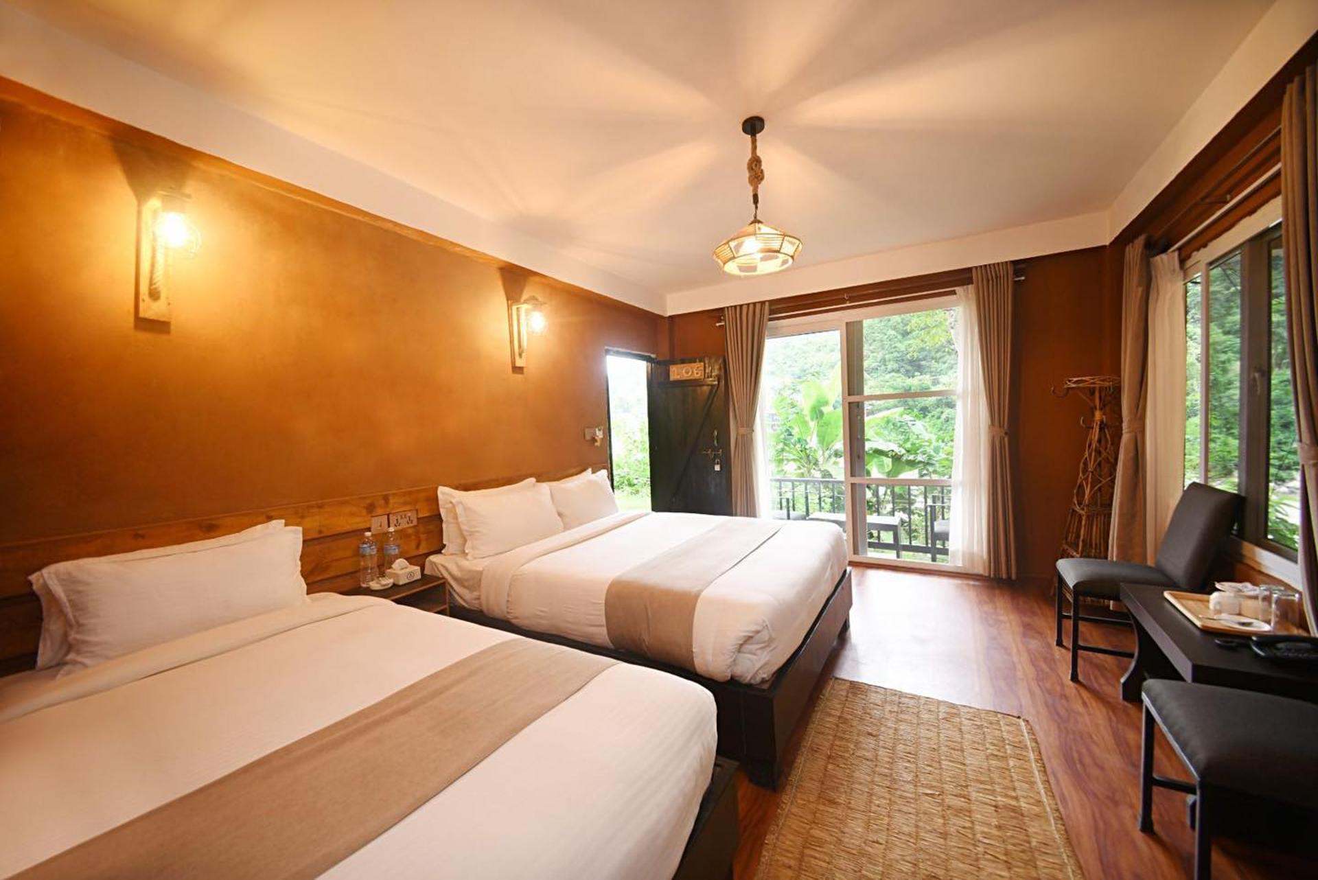 Deluxe Triple AC river view and Balcony Room
