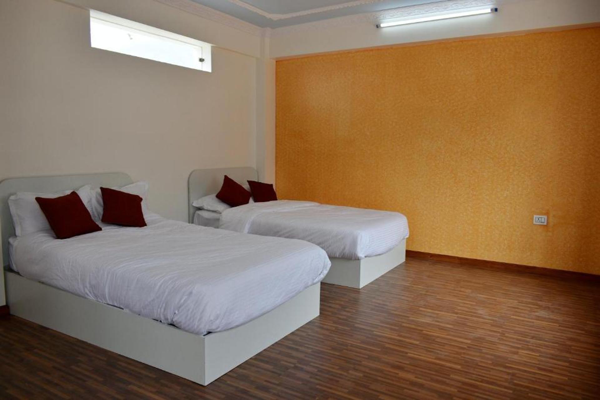 Twin Beds with attached bathroom