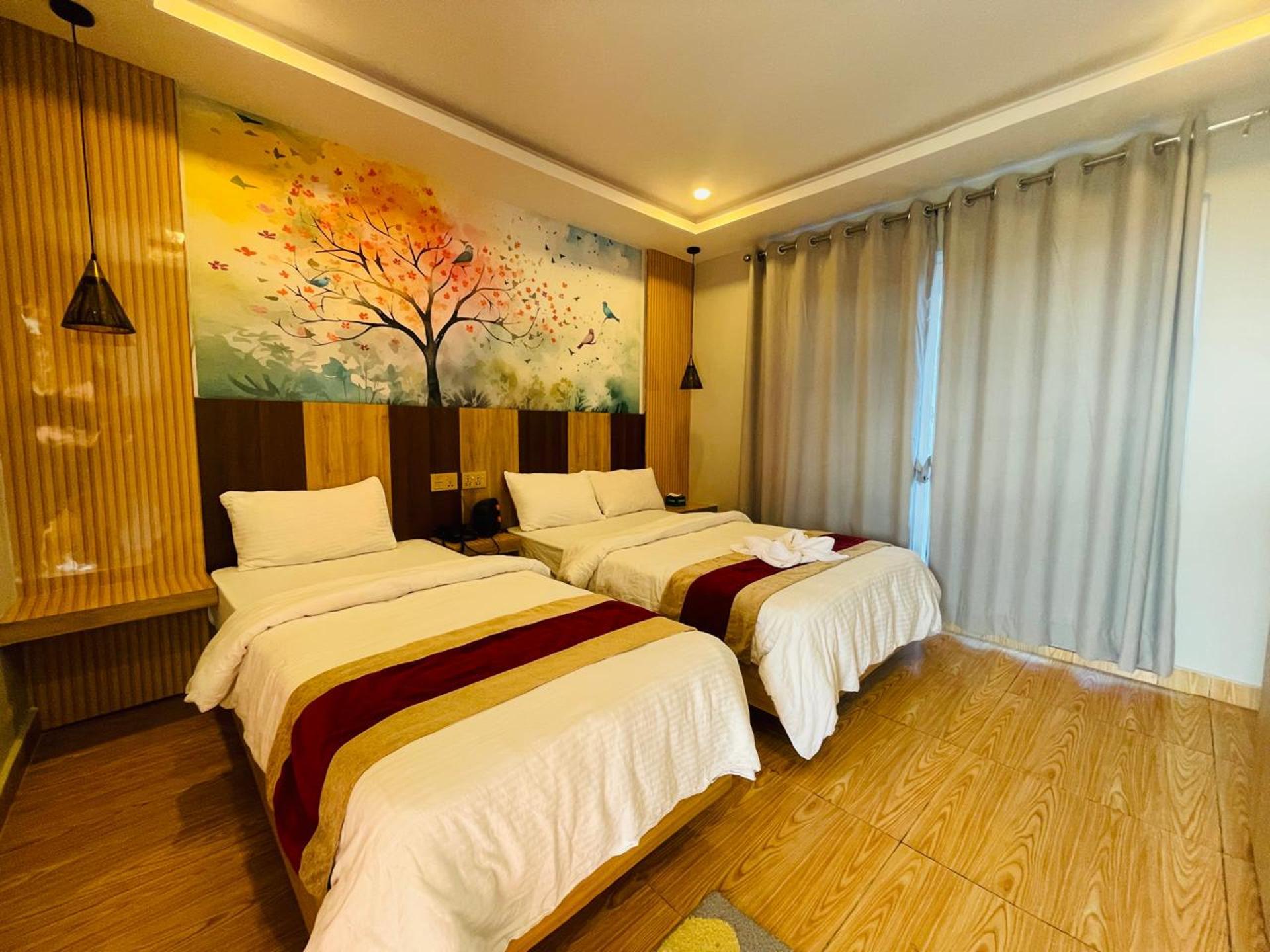 Deluxe Single & Double Bed Room